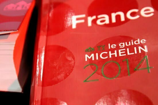 Copies of the new 2014 annual Michelin restaurant guide are presented in Paris