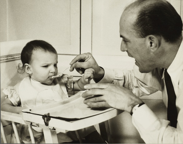 Lenox Hill, 1948-1949 Album, Man Feeding Baby