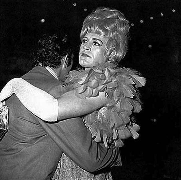 Seated transvestite with crossed ankles, N.Y.C., 1966