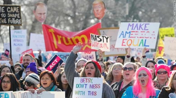 Protesters cheer at the Women's March in Chicago, Illinois.