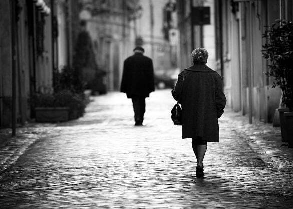 A man and woman walking away