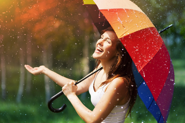 Happy-woman-in-the-rain-Stock-Photo